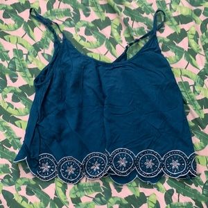 Small cute crop top with a beaded pattern on the bottom